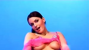 Busty Brunette Is Stripping And  In Front Of A Blue Screen