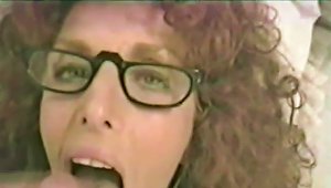 Curly Haired Brunette Wearing Glasses Does An Outstanding Blowjob