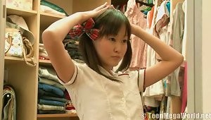 Asian Teen Dresses As Schoolgirl