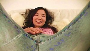 This Asian Girl Sheds Her Jeans And Fucks Her  With A Toy
